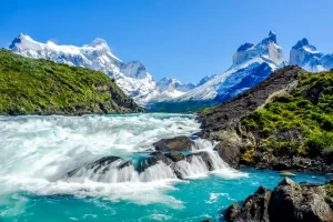 Salto Grande Waterfall with the Andes mountain range in the background at Torres del Paine National Park, Chile.