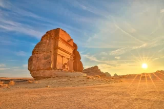 Hegra desert of AlUla, Saudi Arabia, bathed in the warm glow of the setting sun