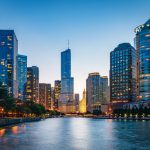 Beautiful illuminated Chicago Cityscape from Chicago River Waterfront at Dusk. Long time exposure. Chicago, Illinois, USA.