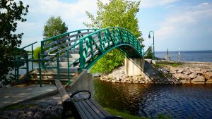 Green arch bridge over water in Roberval