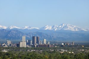 Denver Colorado skyscrapers snowy Longs Peak Rocky Mountains copy space