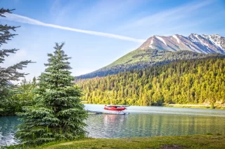 Red float plane parked on the waters of Upper Trail Lake on the Kenai Peninsula of Alaska USA