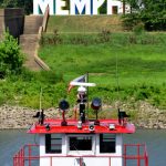 Pilot house on a cruise boat, docked in Memphis, Tennessee, faces the big sign that says Memphis.
