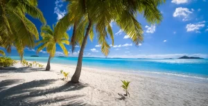 Tropical beach in Aitutaki Lagoon in the Cook Islands in the South Pacific Ocean.