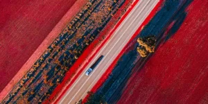 Aerial image of the road in Western Australian Golden outback.The soil is red as it is rich in iron ore.