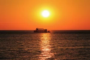 cruise boat on a lake Michigan at sunset