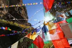 Colorful Buddhist prayer flags at Taktshang Goemba or Tiger's nest monastery in Paro, Bhutan.