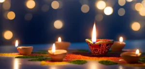 Happy Diwali, Diya lamps lit on colorful rangoli with bokeh light background