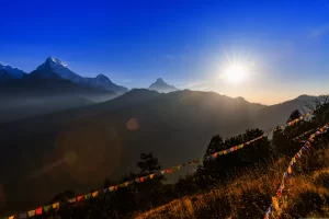Landscape photo of beautiful sunrise and prayer flags on Poon hill in nepal