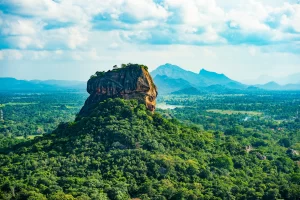 Spectacular view of the Lion rock surrounded by green rich vegetation. Picture taken from Pidurangala Rock in Sigiriya, Sri Lanka.