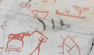 Prehistoric rock carvings with animals and people, protected by Unesco, in Alta, Norway