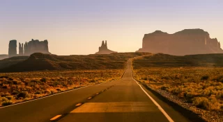 Highway Road U.S. Highway 163 and Monument Valley at sunset, Arizona, USA