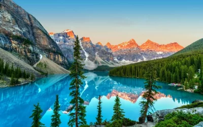 Golden sunrise over the Valley of the Ten Peaks with glacier-fed turquoise-colored Moraine Lake in the foreground near Lake Louise in the Canadian Rockies of Banff National Park.
