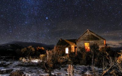 With a flashlight and a few lanterns, this old farm house seems to have company once again underneath clear Idaho skies.