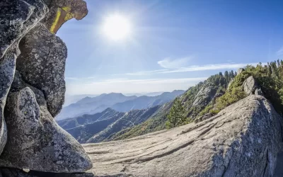 Moro Rock against sun, unique granite dome rock formation in Sequoia National Park, USA.