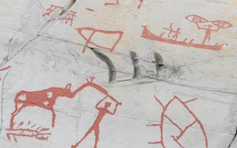 Prehistoric rock carvings with animals and people, protected by Unesco, in Alta, Norway