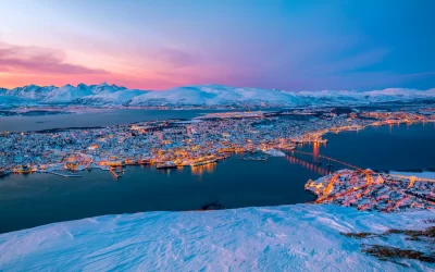 A Beautiful Twilight Sunset Sky during Winter Time at Fjellheisen Cable Car Station above the City of Tromso, Norway.