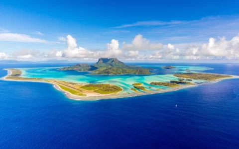Aerial panoramic view of Bora Bora, French Polynesia and its famous lagoon located in the South Pacific Ocean