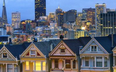 Famous painted ladies after sunset with San Francisco downtown in the background
