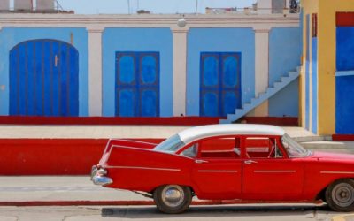Old red car parked on the street in Trinidad, Cuba.