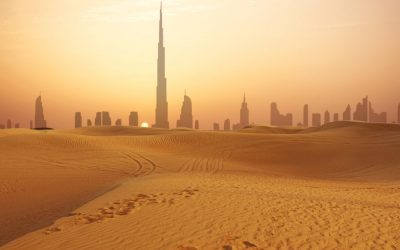 Dubai city skyline at sunset seen from the desert