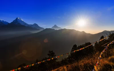 Landscape photo of beautiful sunrise and prayer flags on Poon hill in nepal