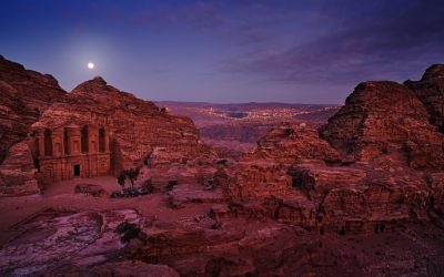 Petra historical sight - Ad Deir Monastery with full moon during the night.